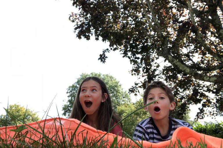 Image shows boy and girl having fun playing